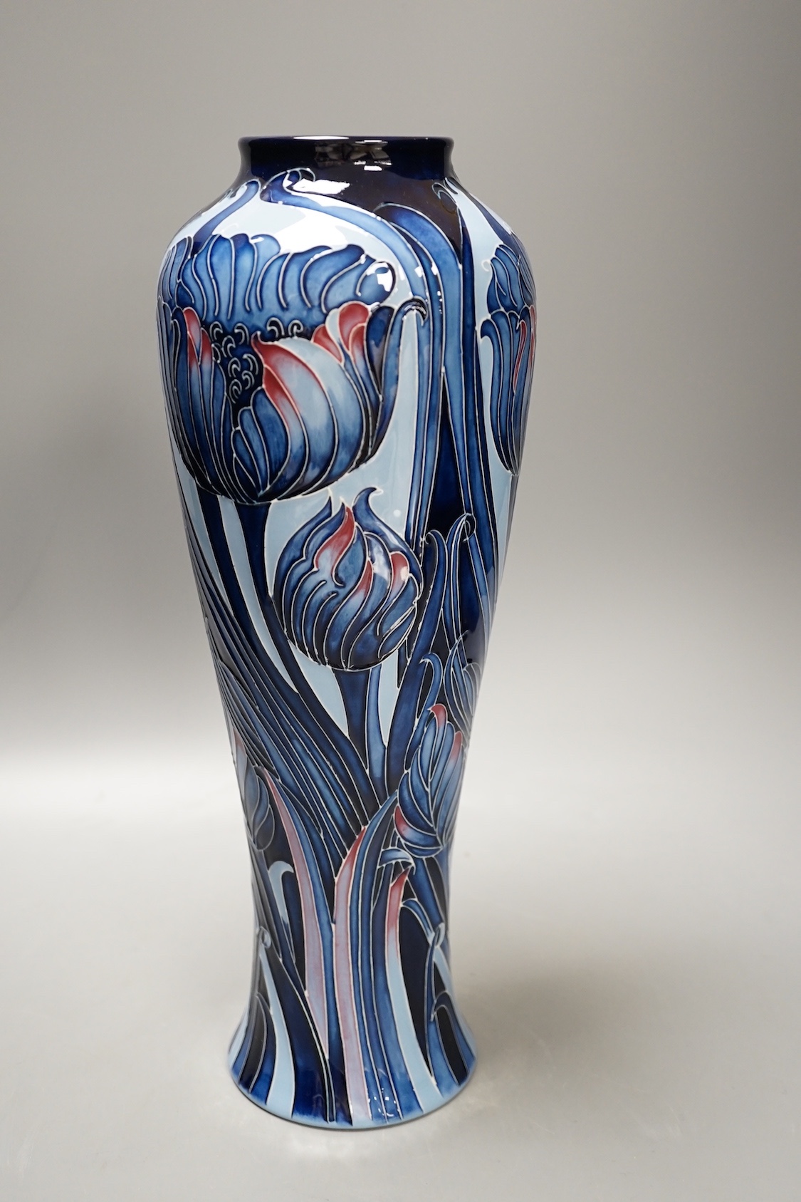 A Moorcroft 'blue tulip' vase, 2013, limited edition, 41/50, boxed, 37 cms high.